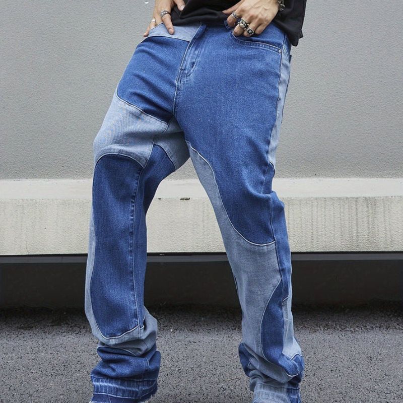 Trendy denim zomerbroek voor heren met patchworkdesign en comfortabele pasvorm.
