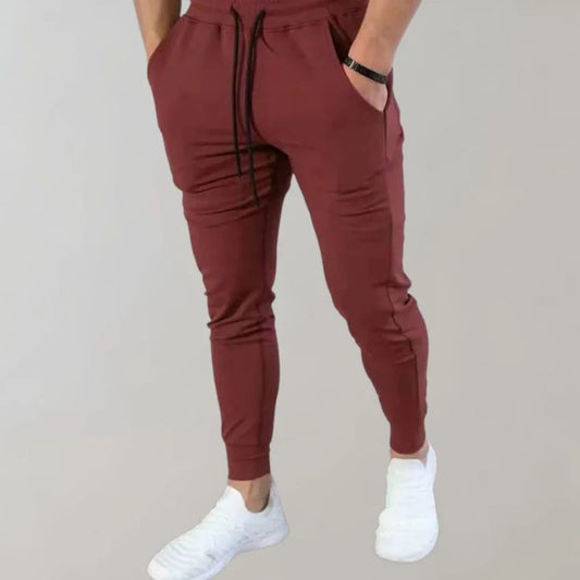 Modieuze en comfortabele heren joggers met nauwsluitende pasvorm en elastische tailleband.







